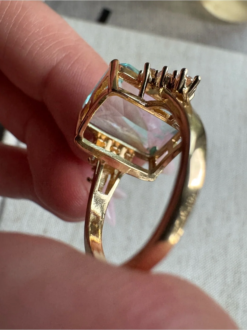 Stunning gold tone ring with blue crystal